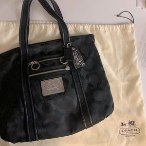 Black Coach bag with signature artwork